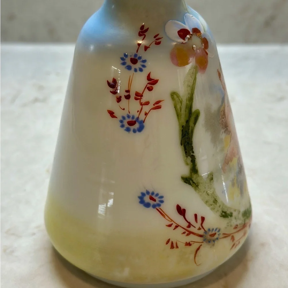 ANTIQUE BARBER SHOP BOTTLE WITH ATTRACTIVE CHERUB PICTURED ON FRONT SIDE.